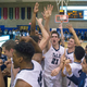 Yale guard Nick Victor (21) and teammates, celebrating their Saturday win against Columbia, raise 4 fingers in reference to recently expelled captain Jack Montague. (Image via Bryan R. Smith/AP)